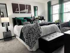 a bedroom decorated in black, white and green