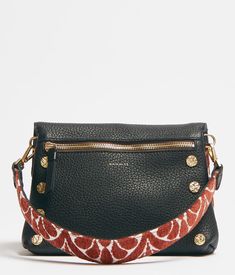 Wear this versatile handbag as a clutch or crossbody with the removable, adjustable strap. This bag can also switch between 6 looks by flipping the two zippered flaps and straps. Featuring a Texas Tapestry print, black pebbled leather, red cotton twill lining, and heirloom gold hardware. 8.5" x 3" x 5.5" Luxury Crossbody Clutch With Zipper Closure, Designer Clutch With Detachable Strap For Everyday, Luxury Clutch With Adjustable Crossbody Strap, Designer Crossbody Clutch For Everyday Use, Designer Clutch With Removable Pouch Crossbody, Tapestry Print, Black Pebbles, Small Crossbody Bag, Small Crossbody