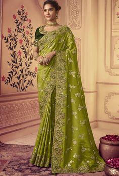 This saree is made of high-quality silk and features intricate embroidery, making it a unique and elegant garment. The deep hue is sure to make a statement and is perfect for special occasions. Crafted with skill and care, this saree is sure to turn heads. Stitching Option - We will email you the measurement guide to confirm your size. FABRIC: Fancy Silk SAREE FABRIC SIZE: 5.5 Meters BLOUSE FABRIC SIZE: 0.80 Meters SHIPPING: The product will be shipped within 1 - 2 weeks from the date of purchas Pista Green, Indian Designer Sarees, Fancy Sarees Party Wear, Plain Saree, Indian Party Wear, Green Border, Green Shades, Punjabi Suit, Green Saree