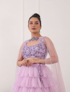 Lilac tulle ruffled lehnga with tonal 3D embellished floral blouse, complete with choker style duppatta and hangings. Net Blouse, Net Lehnga, Net Duppatta and Shantoon Lining Sequins and cutdana Round Lilac Color Cut Sleeves 3 Pieces Semi-stitched Ruffled Lehenga For Reception, Festive Floral Organza Gown, Party Anarkali Dupatta With Ruffles, Anarkali Party Dupatta With Ruffles, Ruffled Choli For Party Wear, Ruffled Choli For Reception Party Wear, Party Wear Choli With Ruffles For Reception, Anarkali Style Ruffled Lehenga For Party, Anarkali Lehenga With Ruffles For Party