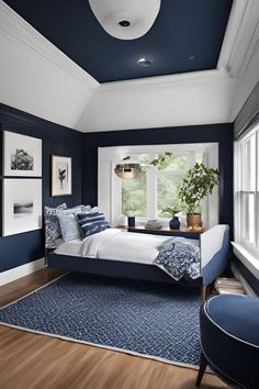 a bedroom with blue walls and white trim on the ceiling, along with an upholstered bed