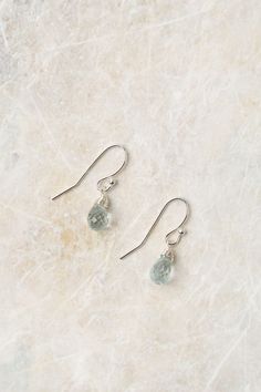 Experience the beauty of these exquisite earrings featuring a sterling silver wire wrapped aquamarine birthstone. Perfect for those born in March! Sterling Silver (lead and nickel free) Aquamarine On sterling silver ear wires We hand select our natural materials, thus there may be slight variations in color and/or size that will not detract from the overall aesthetic Our unique handcrafted designer jewelry for women is made in America, with each design created individually in our personal design Minimalist Silver Earrings For May Birthstone, Silver Aquamarine Dangle Earrings, Aquamarine Drop Earrings With Ear Wire, Delicate Sterling Silver Birthstone Earrings, Delicate Silver Birthstone Earrings, Silver Briolette Earrings With Birthstone, Delicate Briolette Sterling Silver Earrings, Silver Briolette Crystal Earrings With Ear Wire, Hypoallergenic Silver Briolette Earrings