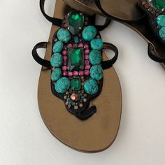 A Gorgeous Pair Of Giuseppe Zanotti Sandals . Made Of Black Suede Embellished With Turquoise , Emerald Pink And Rust Color Stones . Hardly Worn In Perfect Condition . Size 381/2 Which Fits An 8. Designer Embellished Open Toe Sandals, Designer Crystal Embellished Sandals For Summer, Bohemian Embellished Party Sandals, Designer Rhinestone Sandals For Summer, Beaded Open Toe Sandals For Evening, Designer Embellished Flat Sandals, Elegant Embellished Sandals For Vacation, Embellished Flat Evening Sandals, Summer Cocktail Embellished Sandals