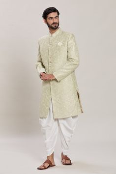 Pista green full sleeves malai silk kurta with all over Gulbahar embroidery using zari and sequin highlights. Paired with a white peshawari pant. - Aza Fashions Ceremonial Pista Green Kurta With Zari Work, Ceremonial Pista Green Kurta With Pallu, Ceremonial Green Kurta For Navratri, Green Ceremonial Kurta For Navratri, Pista Green Ceremonial Kurta For Diwali, Pista Green Kurta For Diwali, Green Bandhgala With Zari Work For Navratri, Pista Green Sherwani With Resham Embroidery For Festive Occasions, Bollywood Style Green Sherwani With Cutdana