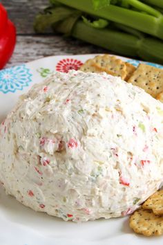 a white plate topped with crackers and cheese