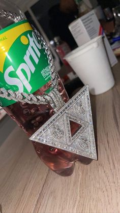 a can of sprite soda sitting on top of a wooden table