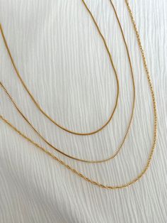 18 inch dainty necklaces, layer together or wear alone for a chic everyday stack Dainty Layered Snake Chain Necklace, Dainty Multi-strand Charm Necklaces For Layering, Everyday Multi-strand Charm Necklace With Delicate Chain, Box Twists, Dainty Necklaces, Dainty Necklace, Box Chain, Jewelry Care, Gold Necklace