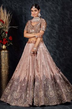 Onion pink flared tissue organza lehenga with spluttered sequin embellishments and Padma bloom gota-sequin embroidery. Paired with a flattering leaf neck blouse with bahar bloom gota-sequin embroidery and a sequin border embellished organza dupatta. - Aza Fashions Pink Dola Silk Sets For Wedding, Pink Tissue Silk Lehenga For Reception, Pink Tissue Silk Lehenga With Unstitched Blouse, Pink Tissue Silk Choli With Unstitched Blouse, Pink Tissue Silk Lehenga For Diwali, Pink Tissue Silk Choli For Reception, Pink Art Silk Gown For Reception, Reception Lehenga With Pallu In Organza, Organza Lehenga With Pallu For Reception