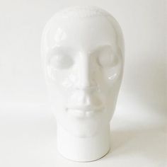 a white ceramic head is shown against a white background