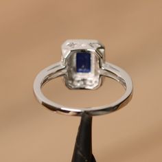 It is real created sapphire ring, the emerald cut sapphire is about 5mm*7mm. The basic metal is sterling silver and plated with rhodium. To change the metal to a solid gold (white/rose) or platinum is also available, please ask for a quotation if you want. You can also go to my shop Home for more elegant rings: https://www.etsy.com/shop/godjewelry?ref=hdr_shop_menu Sapphire is the birthstone of September. More sapphire rings: https://www.etsy.com/shop/godjewelry?ref=listing-shop2-all-items-count Sterling Silver Birthstone Ring, Blue Sapphire Engagement Ring, Ring Sapphire, Sapphire Engagement Ring Blue, Sapphire Engagement Ring, Elegant Ring, Sapphire Engagement, Sapphire Gemstone, Engagement Rings Sapphire