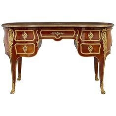 an antique desk with gold trimmings and drawers on the top, against a white background