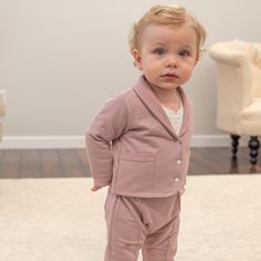 Handmade in the USA The Milo Baby Boy Suit is crafted with our premium French Terry, a soft material with a beautiful texture in custom colors hand-selected by our designer. The lovely texture and feel of the material adds a unique take on our beloved baby boy 3-piece suit design. Includes the matching Jacket, Pants & Cotton Shirt. The jacket features a fold over collar, pockets and shell buttons. Pair with the matching newsboy cap and booties to complete the look that is perfect for any spe Formal Cotton Sets For Fall, Fitted Pink Cotton Suit, Pink Fitted Cotton Suit, Formal Pink Cotton Sets, Pink Cotton Sets Suitable For Work, Baby Boy Dress Clothes, Baby Boy Dress, Suit Design