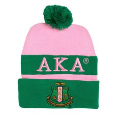 a pink and green hat with the letters aka on it