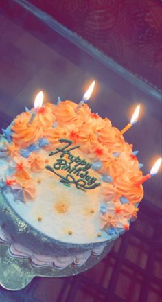 there is a birthday cake with candles on it