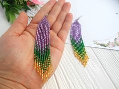 Mardi gras earrings dangle, Long statement earrings, festival beaded earrings, Women shining earrings purple green gold, mardi gras gift Looking for something to complement the festival image? Consider these earrings. -Created in the colors of the festival -Goodly combined not only with the appropriate suit but also for everyday images. -Made of quality Czech beads. -I can be a wonderful gift for the holiday. -Gift packaging and personalized postcard are available. -You can add a silver hook if Purple Jewelry For Mardi Gras, Green Chandelier Earrings For Party, Green Jewelry For Mardi Gras Party, Purple Dangling Beads Earrings For Party, Purple Dangling Beads Party Earrings, Handmade Gold Jewelry For Mardi Gras, Purple Beaded Jewelry For Mardi Gras, Bohemian Jewelry For Mardi Gras Party, Bohemian Mardi Gras Party Jewelry