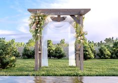 an outdoor wedding setup with flowers and greenery