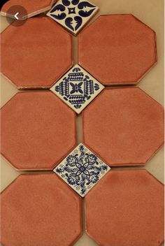 an orange and blue tile pattern on the wall