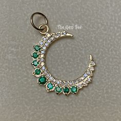 "Thank you for coming in! Genuine 14K GOLD diamond natural emerald charm pendant. This particular Yellow gold large moon charm has small diamond accents(0.25 carat) and natural emerald stones(0.44 carat) on it! THEY ARE STAMPED WITH \"14K 0.25ct\", but I could not show it clearly in the pictures. Amazing quality diamonds and finest green emerald stones in this piece!  DIMENSION: 18mmx24.5mm including 3.5mm jump ring, plus 6.3 mm top bail loop, 4.5mm hole MATERIAL: 14K Yellow Gold,  natural diamond, natural emerald"