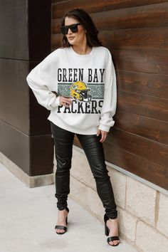 Stand out from the crowd in our Green Bay Packers premium fleece long sleeve sweatshirt. Boasting an oversized fit, crewneck and ribbed knit neckline, wrists, and waistband, it effortlessly blends comfort with fashion. Show your support for your favorite school or team in this irresistibly soft sweatshirt. Oversized Fan Apparel Sweatshirt For Fall, Fan Apparel Long Sleeve Sweatshirt For Fall, Fleece Sweatshirt For Fall Fan Apparel, Oversized Sweatshirt With Ribbed Cuffs For Game Day, Fall Fleece Sweatshirt For Fans, Game Day Crew Sweatshirt, White Long Sleeve Sweater For Game Day, Oversized Crew Neck Sweatshirt For Game Day, Green Long Sleeve Sweatshirt For Game Day