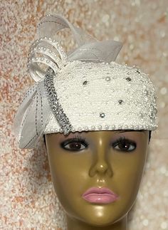 Simple, yet elegant. White lace Fascinator half hat trimmed with pearls, rhinestones, and bow. The hat is affixed to the head via a hatstring. The hat's circumference measures approximately 22.5 inches. (hat size 22.5 inches) PLEASE NOTE All items for Free Shipping will be shipped via USPS First Class Mail. Elegant Hat With Satin Bow For Party, Elegant Party Hat With Satin Bow, Elegant Wedding Hats With Satin Bow, White Gatsby Style Fascinator For Evening, Elegant Church Top Hat With Headband, Elegant Bead Cap Headband, Elegant Adjustable Hats With Bead Caps, Elegant Costume Hats For Ceremonies, Elegant Church Headband Hat