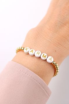 Beautiful gold plated beads bracelet with personalized wishing text. You can wear this delicate lucky charm bracelet individually or combine it with other arm jewelry. The stones are strung on a stretch band, making the bracelet easy to slip over your hand. ❤ Handmade with love I High-quality workmanship I Lovingly packed ❤ DETAILS Brass beads 14k gold plated 3mm Acrylic letter beads 7mm Elastic nylon band Please enter the desired name (max. 10 letters) in the personalization field when placing your order.  ❤ More bracelets here: https://www.etsy.com/de/shop/GluecksbringerinShop?ref=search_shop_redirect&section_id=27892143 ❤ My shop: https://www.etsy.com/de/shop/GluecksbringerinShop?ref=search_shop_redirect Bracelet Easy, Lucky Charm Bracelet, Arm Jewelry, Acrylic Letters, Letter Bracelet, Brass Beads, Stretch Band, Personalized Letters, Pretty Jewelry