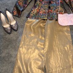 A Beautiful Pair Of Dress Pants. Paired With Silver And Gold Heals Pink Purse And Multiple Color Jacket. Inseam Is 32 Inches. Womens Gold Pants, Elegant Gold Silk Bottoms, Spring Evening Silk Pants, Silk Evening Pants For Spring, Gold Silk Bottoms For Party, Chic Ankle-length Pantsuit For Party, Glamorous Spring Formal Pantsuit, Spring Silk Pantsuit With Long Sleeves, Spring Party Wide-leg Pantsuit