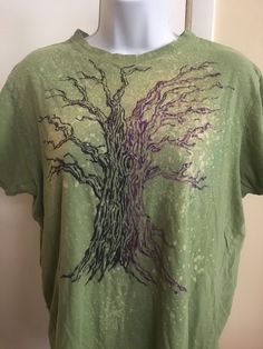 Our Treeshirts feature our art on upcycled shirts and tops, which was all done by hand with no printing involved. Thus, each one is a one of a kind piece of art that you can wear, and are duly numbered in a series, in this case: TR 98. The artwork here was done with bleach, and black and purple permanent inks.  The tag is faded. This top is thought to be an XL but for clarity, these measurements were taken:  Shoulder to shoulder width is 17 7/8 inches Armpit to armpit seam is 21 inches Length from top of top seam in the front of the shirt, to the bottom of shirt: 22 inches Sleeve length is 7 inches. Relaxed Fit Cotton Tops With Custom Artwork, Relaxed Fit Hand Printed Crew Neck Top, Hand Printed Crew Neck Top With Relaxed Fit, Cotton Tops With Custom Artwork For Summer, Vintage Hand Printed Crew Neck Tops, Crew Neck Cotton Top With Custom Artwork, Cotton Crew Neck Top With Custom Artwork, Artistic Green Cotton T-shirt, Green Bohemian Top With Graphic Print