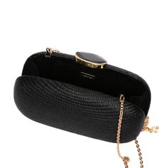 Need an elegant alternative to the usual black satin evening zippered pouch? Turn heads with the Dark Sky oval. The lustrous case is a certain conversation starter once you reveal that it is made of handwoven natural plant fibers in a technique traditionally used for hats. Its crowning glory is the agate stone capped with hand-tooled brass. A brass drop-in chain allows you to carry this beauty on your shoulder or as a clutch under your arm. Fully lined, the compact interior keeps your mobile phone, credit cards, and lipstick ready at hand. - Measurements: 8" width x 2.5" depth x 4.5" height, brass chain strap 19" drop - Body: 100% natural plant fiber, Chain Strap: Brass Chain - Made in the Philippines in our own Larone atelier in collaboration with weavers and artisans From the time my mot Elegant Formal Woven Bags, Black Woven Bags For Formal Occasions, Elegant Woven Evening Bag, Formal Black Woven Bags, Formal Black Woven Bag, Woven Clutch Evening Bag, Elegant Woven Clutch, Chic Woven Clutch For Formal Occasions, Elegant Woven Clutch For Party