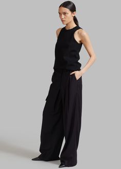 Color: Black Midweight woven twill Half black half pinstripe detailing Low rise Pleated front Enlarged cargo pocket on one leg Slant hip pockets Illusion welt back pocket and flap pocket Zip fly Asymmetric tab closure Unlined 70% Polyester 30% Rayon Dry Clean Imported Pinstripe Pants, Cargo Pocket, Flap Pocket, Black Pants, Low Rise, Dry Clean, Pants, Black, Color