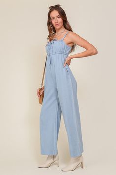 THE PERFECT MIX OF FLIRTY AND FUN, THIS JUMPSUIT IS READY FOR ANY SUMMER OCCASIONS. THE FLOWY SILHOUETTE IS COMPLEMENTED BY A SQUARE NECK LINE, RUCHED BUST, AND FRONT KEYHOLE DETAILS. WHETHER YOU ARE SIPPING COCKTAILS OR DANCING THE NIGHT AWAY, THIS DENIM BLUE JUMPSUIT WILL HAVE YOU FEELING THE BEST.* SLEEVELESS DESIGN* SPAGHETTI STRAP* SELF FRONT TIE* FRONT KEY HOLE* LIGHTWEIGHT MATERIAL* THE MODEL IS 5'9" AND WEARING SIZE SMALLMade In: ChinaFabric Contents: 90% cotton 10% viscoseSize Measureme Sleeveless Solid Denim Jumpsuit For Summer, Solid Sleeveless Denim Jumpsuit For Summer, Summer Cotton Denim Jumpsuit, Solid Cotton Denim Jumpsuit For Summer, Trendy Blue Jumpsuits And Rompers For Day Out, Trendy Solid Color Denim Jumpsuit For Summer, Spring Light Wash Relaxed Fit Denim Jumpsuit, Chic Light Wash Cotton Jumpsuits And Rompers, Trendy Light Wash Jumpsuits And Rompers For Spring