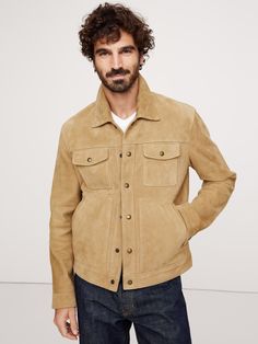 Utilitarian in style with flair from the past, this classic trucker jacket is expertly crafted from soft and supple suede, chosen for its timeless texture, ensuring a lifetime of luxurious style.  WARMER: Fully lined so you can layer it through the seasons.  Spread collar with snap closure.  Chest pockets with snap closure.  Side pockets.  Two interior pockets.  Straight hem.  Fully lined.  LEATHER WORKING GROUP: By purchasing this product, you are supporting responsible leather manufacturing th Luxury Outerwear With Suede Lining For Fall, Suede Leather Jacket With Flap Pockets, Classic Suede Leather Jacket With Flap Pockets, Suede Leather Jacket With Lapel Collar For Fall, Classic Suede Outerwear With Flap Pockets, Suede Outerwear With Welt Pockets For Fall, Fall Suede Outerwear With Welt Pockets, Classic Fall Outerwear With Suede Lining, Collared Suede Leather Jacket With Flap Pockets