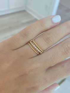 Add this delicate beaded design 14K gold band to any finger --- it is easiest ring to layer into your everyday jewelry routine! Dainty 14k Gold-filled Stackable Promise Rings, Elegant Rose Gold Stackable Rings In 14k Gold Filled, Elegant 14k Gold-filled Rose Gold Stackable Rings, Elegant Rose Gold Stackable Rings 14k Gold Filled, Dainty Stackable Bands, Elegant Stackable 14k Gold-filled Promise Rings, Elegant 14k Gold Filled Stackable Rings, Dainty Diamond Eternity Band For Everyday, Elegant 14k Gold Filled Stackable Promise Rings