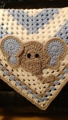 a crocheted blanket with an elephant on it