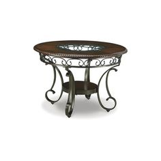 a round table with an iron frame around it and glass top on the bottom shelf