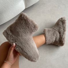 Stay cozy all autumn! These fluffy slipper boots will keep your feet warm and snug. Featuring a rounded toe, flat sole and a faux fur finish. Style them with matching coloured pjs or loungewear. - Faux fur upper - Model wears UK 4 / EU 37 / US 6 - Fit true to size Cozy Brown Slippers For Winter, Cozy Winter Boots With Plush Lining, Cozy Slippers With Plush Lining For Loungewear, Fluffy Round Toe Slippers For Loungewear, Comfy Fluffy Slippers For Loungewear, Fluffy Comfy Slippers For Loungewear, Cozy Faux Fur Slippers With Round Toe, Super Soft Slippers For Winter Loungewear, Super Soft Winter Slippers For Loungewear