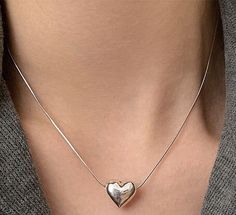 Trendy Sterling Silver Heart Pendant Necklace, Trendy Sterling Silver Heart Pendant Charm Necklace, Trendy Sterling Silver Charm Necklace With Heart Pendant, Simple Heart Pendant Necklace For Everyday, Minimalist Necklace With Heart Pendant Detail, Minimalist Heart Necklace With Adjustable Chain, Trendy Everyday Heart Pendant Necklace, Minimalist Heart Detail Necklace For Everyday, Simple Silver Heart Pendant Necklace