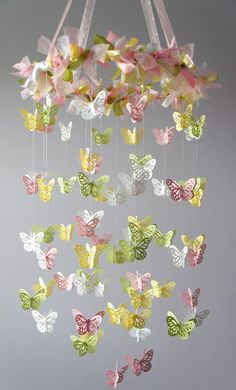 a wind chime with many butterflies hanging from it