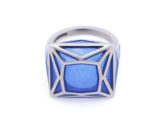 Blue plique-à-jour enamel ring in 18K white gold. Signed SA-P for Solange Azagury-Partridge, with English hallmarks. The retail price is £5800 (approximately $7500). Plique-à-jour is a difficult enameling process in which enamel is applied to an area with no backing instead of onto metal. The result is the enamel is transparent or translucent.