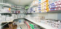 the shelves are filled with many different types of toilet paper and other items for sale