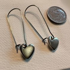 Stainless Heart Earrings Stainless Steel Heart 10mm 1 1/2”” Inch Length Handcrafted By Pixie Life Simple Elegant Casual Bundle Discount Pretty Packaging #245 Aesthetic Artsy Eclectic Streetwear Style Art Design Handcrafted Handmade Jewelry Earrings Elegant Minimalist Chic Boho Bohemian Hearts Silvery Gray Trendy Hipster Millennial Work Essentials Trending New School Style Casual Gift Gifts Girl Unique Fall Spring Summer Vacation Memories Winter Artisan Steel Stainless Hypoallergenic Dangle Everyday Drop Heart Earrings, Everyday Heart Drop Earrings, Everyday Heart-shaped Drop Earrings, Silver Heart Cut Metal Earrings, Silver Heart Cut Hoop Earrings For Gift, Silver Heart Cut Hoop Earrings As Gift, Minimalist Heart Jewelry With Ear Wire, Everyday Dangle Heart Earrings, Metal Heart Charm Earrings For Anniversary