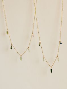 Five pieces of tourmaline, ranging from all shades of green to mauve-y pink, suspended from beaded curb chain. Lovely worn solo or stacked with a favorite necklace. Green Tourmaline Gemstone Necklace, Green Dangle Necklace With Beads, Green Necklaces With Dangling Beads, Green Gemstone Beads Necklaces, Green Gemstone Beads Dangle Necklaces, Green Gemstone Beads Dangle Necklace, Green Gemstone Dangle Necklaces, Handmade Green Tourmaline Necklaces, Green Dangle Necklaces With Gemstone Beads