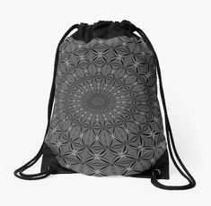 a black and white photo of a drawsack bag with an intricate design on the front