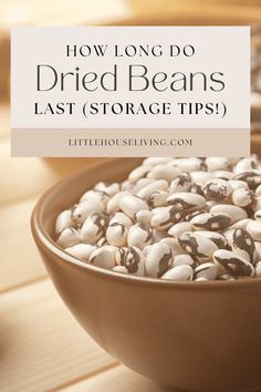 a brown bowl filled with white beans on top of a wooden table