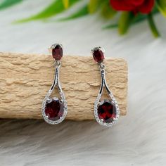 🌟Surprise your loved ones with these captivating garnet earrings, a meaningful present for birthdays, anniversaries, or any special moment! 🎁 🌟PRODUCT DETAILS 🌟 ✨ Gemstone - Garnet ✨Gemstone type- Natural ✨ Gemstone Color - Red ✨ Gemstone Size - 5x3mm,6x4mm ✨ Gemstone Cut- Oval ✨Gemstone weight- 2.85 carats 💫 Material Detail 💫 ✨Metal - Sterling Silver ✨Metal Color- Silver ✨Earring Closure- Push back ✨ Earring Box - Yes 💎 Gemstone Quality 💎 Please note all the gemstones we use completely 100 % Natural, Unheated And Non-Treated Also Provided with GRS Lab Certification. ⭐High Quality Sterling Silver⭐ The Earring is made from sterling silver, known for its durability, shine, hypoallergenic properties and skin tested . 18 k white gold Coated to Protect silver from tarnishing.  ⭐ Versati Elegant Garnet Teardrop Earrings, Elegant Earrings For Valentine's Day Anniversary Gift, Elegant Earrings For Anniversary, Valentine's Day Gift, Elegant Garnet Gemstone Earrings, Garnet Gemstone Earrings For Wedding, Oval Cubic Zirconia Birthstone Earrings, Oval Gemstone Earrings For Anniversary, Oval Birthstone Earrings In Cubic Zirconia, Elegant Oval Garnet Earrings