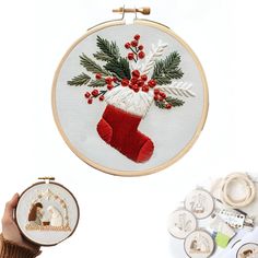 a hand embroidery project with christmas stockings and holly wreaths on the hoop next to other items