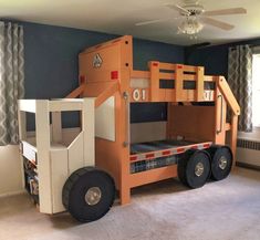 a room with a bunk bed made to look like a truck