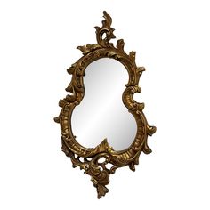 an ornate gold framed mirror on a white background