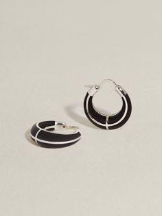 A timeless iteration on our bestselling, signature Arc Hoops — integrating strikingly inky black onyx inlay. These softly rounded, signature hoops are designed for daily wear, measuring approximately 19mm in diameter with a total weight of 9.5 grams (gold), and 7.5 grams (silver). Available in 100% recycled 14k gold only. Explore the Chess capsule for more pieces incorporating black onyx. J Hannah, Jeweled Earrings, Pretty Jewellery, Earings Piercings, Black Onyx, Onyx, Daily Wear, Fine Jewelry, White Gold