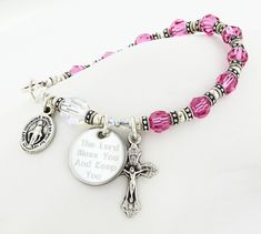 "Represent the Communion girl's birth month with this Swarovski Crystal Rosary Bracelet. The rosary bracelet has 10 Swarovski Crystals to represent the Hail Mary beads and one Super Sparkly Clear Swarovski Crystal as the Our Father bead. It comes with a crucifix and a Miraculous Medal dangling near the clasp. It is available with or without an Engraved Disc and it comes with your choice of a gift message that is elegantly boxed for simple gift giving. Add an Engraved Disc - Select a Disc option. Crystal Rosary, Personalized Rosary, Bracelet For Girls, Goddaughter Gifts, Simple Gift, Rosary Bracelet, Communion Gifts, Hail Mary, Miraculous Medal