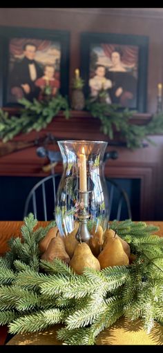 a christmas centerpiece with pine cones and candles